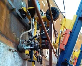 Lift and weld system for tank construction, 18 ton capacity retractable jacks with lifting hooks, internal horizontal welding using automatic SAW machine