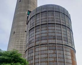 Absorber tank or scrubber tank 34 metres tall erected using Bygging tank lifting jacking system with lifting hooks in order to avoid temporary welds to the C-276 hastelloy plates used in the absorber tank shell; Erection of Absorber tank for flue gas desulphurisation (FGD) unit by jacking method