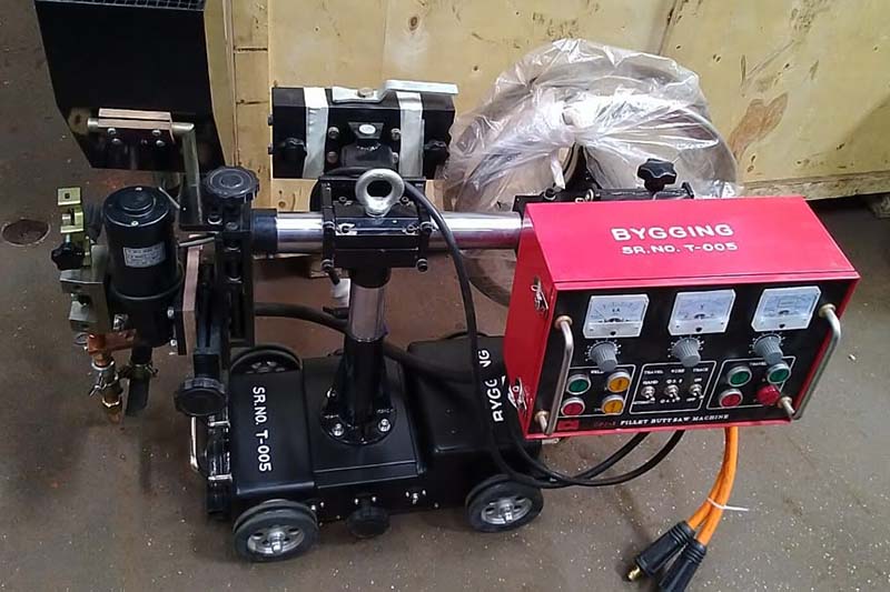 Submerged arc automatic welding tractor with magnetic rollers used for welding of joint between tank shell and annular plate from inside as welll as from outside the tank 