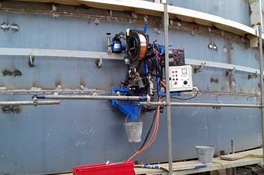 Submerged arc welding using automatic girth welding machine for horizontal welding on storage tanks and absorber / scrubber tanks with C276 liner